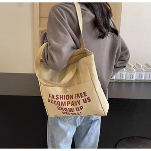 Retro beige canvas tote bag with brown lettering for women, casual spacious shoulder bag