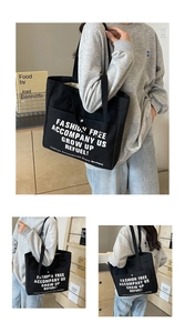 Detailed views of a black canvas tote bag featuring white letter printing and wide shoulder strap