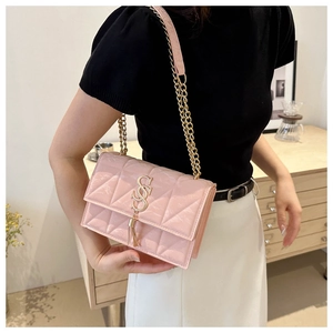 Pink quilted leather crossbody bag with gold chain strap and elegant metal clasp