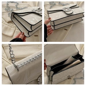 Detail view of marble pattern crossbody bag with rhinestone buckle and chain strap