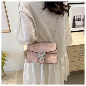 Pink marble pattern crossbody bag with rhinestone buckle and silver chain on model