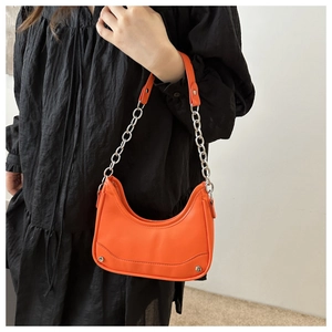 Chic orange hobo shoulder bag with silver chain strap and minimalist moon shape design