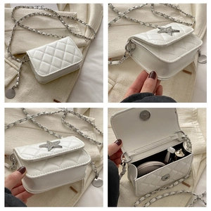 Detail view of white quilted mini bag showing star stud and chain strap details