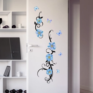 Detailed blue floral and butterfly wall stickers applied on a modern white door