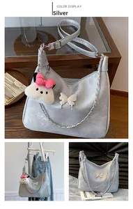 Silver Hobo shoulder bag with white butterfly accents and cute panda plush keychain