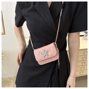 Close-up of pink quilted mini crossbody bag with a sparkling silver star buckle and chain