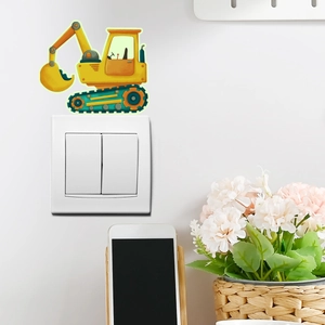 Detailopname van een gele graafmachine muursticker rond een lichtschakelaar wand