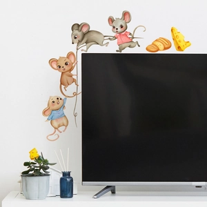 Detail of cute cartoon mouse wall stickers with cheese on a white bedroom background