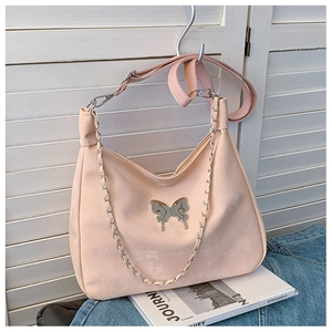 Minimalist peach pink large tote bag with metallic butterfly charm and silver chain strap