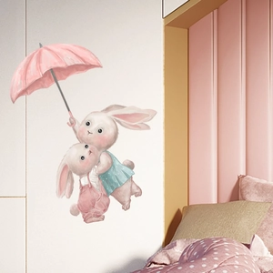 Close-up of cute cartoon rabbits with pink umbrella wall stickers for a kids nursery room