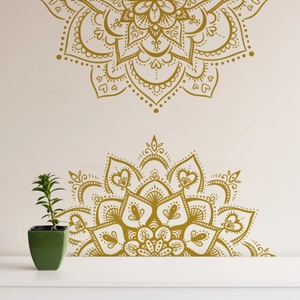 Detailed view of golden Mandala wall decals with intricate geometric patterns on a white wall