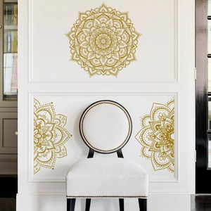 Detailed close-up of golden mandala wall stickers with intricate geometric flower patterns