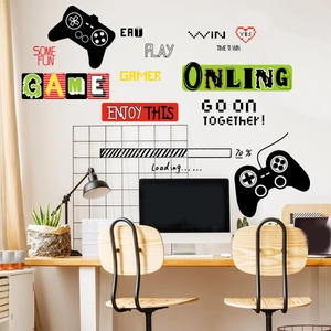 Close-up of gaming wall decals with gamepads and gamer slogans in a modern study room