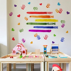 Rainbow wall decal with handprints and hearts for classroom Every One Is Welcome Here sign