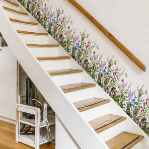 Macro shot of colorful wildflower wall stickers applied along a white staircase wall