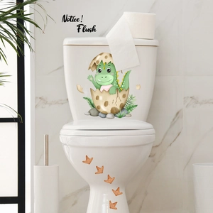 Detail of cartoon green dinosaur toilet stickers with orange footprints in a bathroom