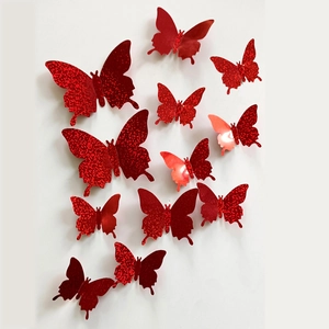 Detail of red glitter 3D butterfly wall stickers with adjustable wings and metal texture