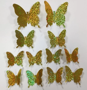 Detail of 3D holographic gold butterfly wall stickers with glitter finish for room decor