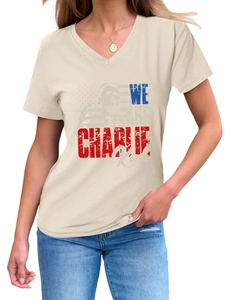 Detail of V-neck beige t-shirt featuring Charlie Kirk print and American flag graphics