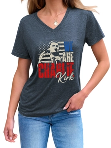 Detail of Charlie Kirk portrait and US flag print on a grey V-neck short sleeve T-shirt