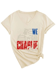 Detailed close-up of V-neck T-shirt with vintage Charlie Kirk graphic and American flag print
