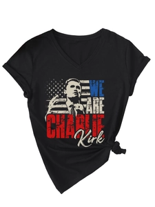 Detail of V-neck T-shirt featuring Charlie Kirk portrait and US flag print on black cotton