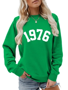 Front detail of emerald green crewneck sweatshirt with white 1976 digital print