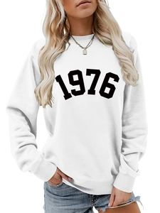 Detail of white 1976 printed sweatshirt featuring a ribbed crew neck and soft cotton fabric