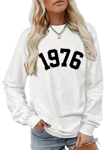 Detail of grey sweatshirt with 1976 digital print and ribbed cuffs for women