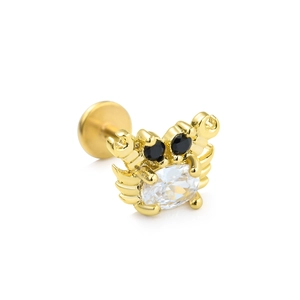 Detailansicht eines krabbenförmigen Labret-Steckers mit Zirkon-Steinen und Goldfinish