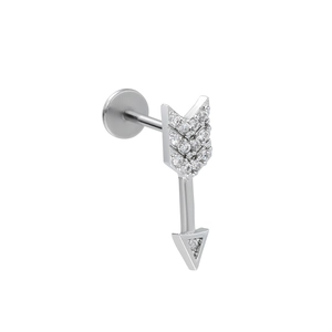 Detailed view of an arrow-shaped stainless steel labret stud set with sparkling zircons