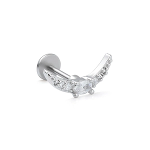 Detailed side view of silver curved lip stud with oval and round cubic zirconia stones