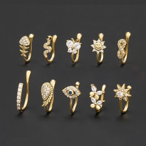 Set di 10 gioielli da naso dorati con zirconi motivi occhio di Allah e farfalla