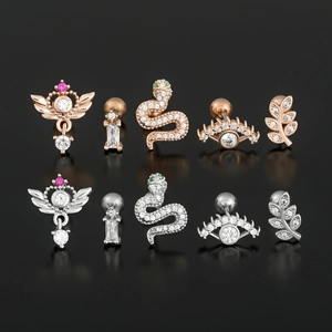 Set of ten stainless steel ear studs with zircon inlays in rose gold and silver finishes
