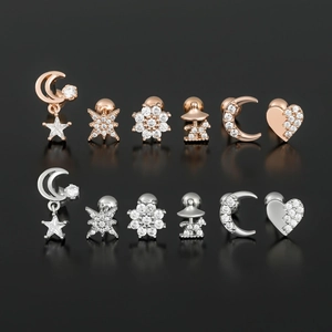 Star and moon ear piercing set with zircon stones in rose gold and silver plating