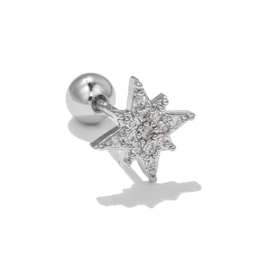 Macro shot of silver octagonal star cartilage stud with cubic zirconia and ball back screw
