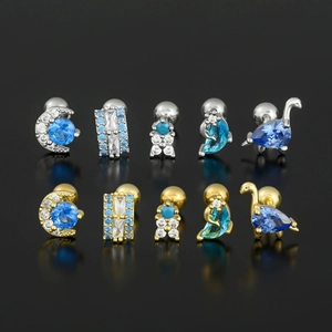 Blue moon zircon stud earrings set in silver and gold stainless steel on black background