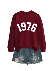 Detail of 1976 print sweatshirt neck and distressed frayed hem denim shorts