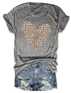 Flat lay of a grey T-shirt with leopard print heart and distressed denim shorts