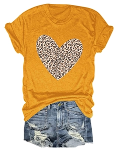Close-up of ginger yellow t-shirt with leopard print heart and distressed denim shorts