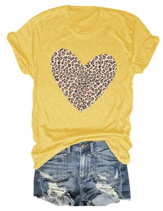 Close-up of leopard heart print on mustard yellow short-sleeve crew neck t-shirt