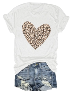 Flat lay of a white cotton t-shirt with leopard heart print and ripped denim shorts