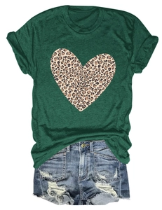 Flat lay of women's dark green T-shirt with leopard heart print and denim shorts