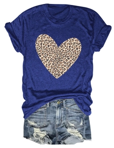 Flat lay of navy blue heart t-shirt with leopard print and distressed denim shorts