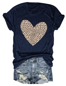 Detail of navy cotton T-shirt featuring a leopard print heart and distressed denim shorts