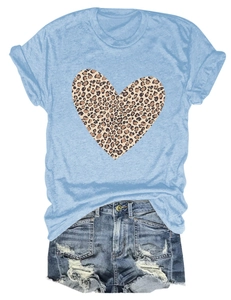 Flat lay of leopard print heart t-shirt paired with distressed denim hot shorts