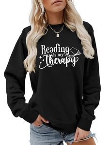 Close-up of black cotton sweatshirt with Reading is my Therapy print and ribbed cuffs