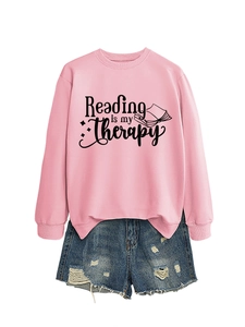 Detail view of Reading is my Therapy print on pink crewneck sweatshirt with ribbed cuffs