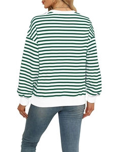 Detail of green and white striped long-sleeve sweatshirt with ribbed cuffs and hemline
