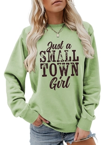 Close-up of Just a SMALL TOWN Girl print on light green long sleeve cotton sweatshirt